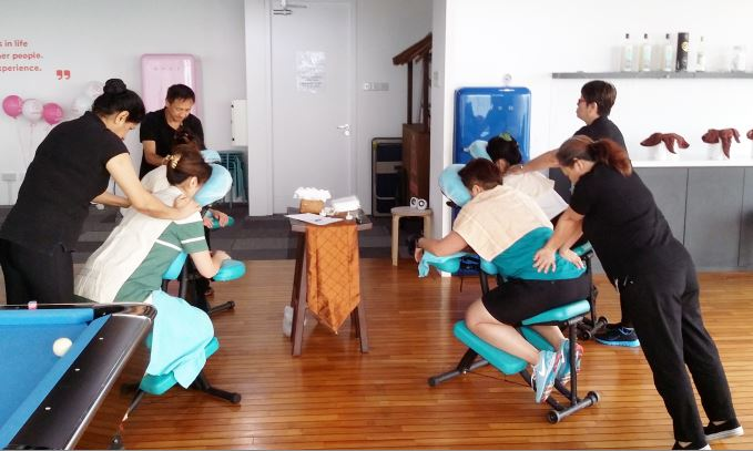 Corporate wellness foot massage at office